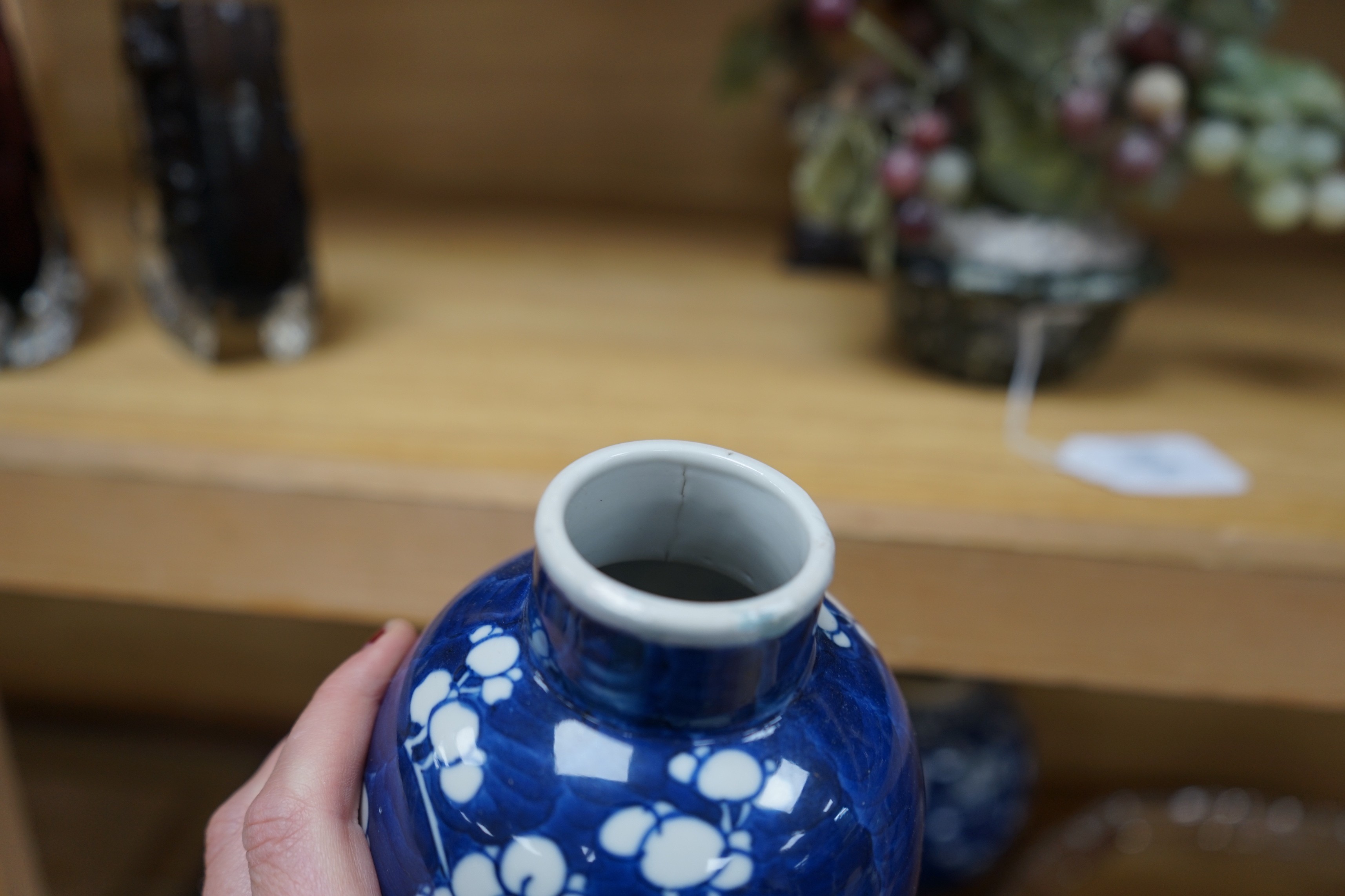 A group of Chinese blue and white prunus vases and jars and covers and jars, pair of vases 23 cms high